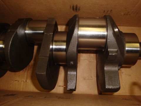 1989 Ford Bronco - Close-up of an engine crankshaft, a critical component for converting linear motion into rotational motion.