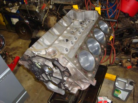 1989 Ford Bronco - Engine block in a workshop setting, likely undergoing a rebuild.