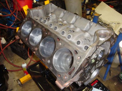 1989 Ford Bronco - Engine block with visible cylinder bores and mounting points, likely undergoing a rebuild.