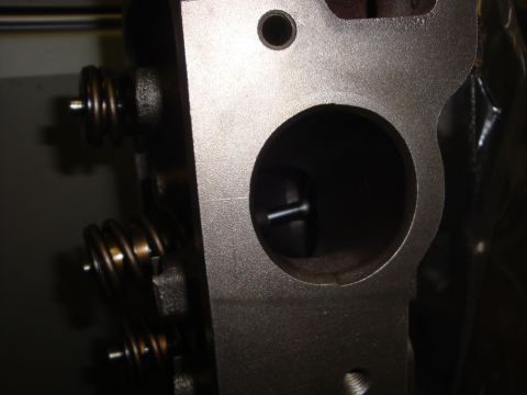 1989 Ford Bronco - Close-up view of an engine cylinder head, showing internal components like valve springs.