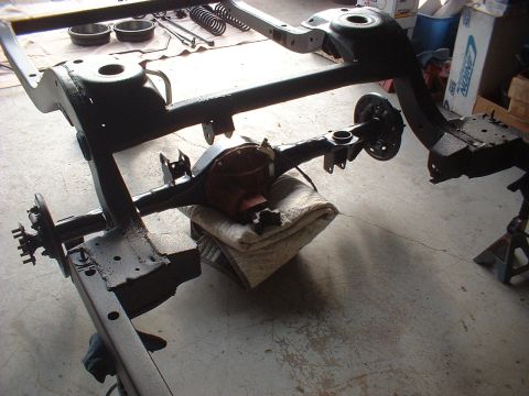 1967 Ford Galaxie - The chassis and rear differential are visible, suggesting a vehicle is being worked on.