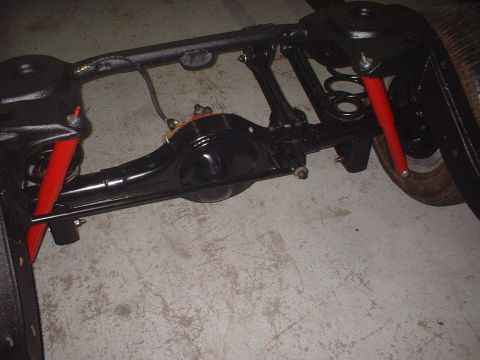 1967 Ford Galaxie - Close-up of a vehicle's rear axle assembly, showing suspension components.