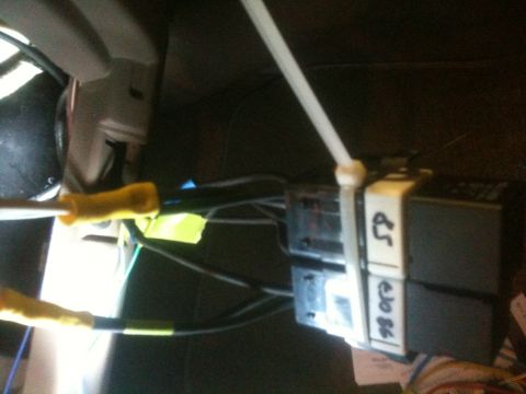 1993 Ford Bronco - Close-up of automotive wiring and relays, with handwritten labels indicating potential model years.