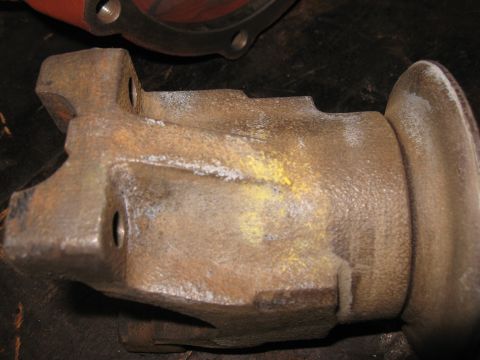 1968 Shelby GT500 - This is a close-up of a metal part, likely from a differential housing, showing signs of rust and yellow markings.