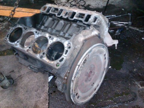 1989 Ford Bronco - Engine block and flywheel, likely part of a vehicle restoration or modification project.