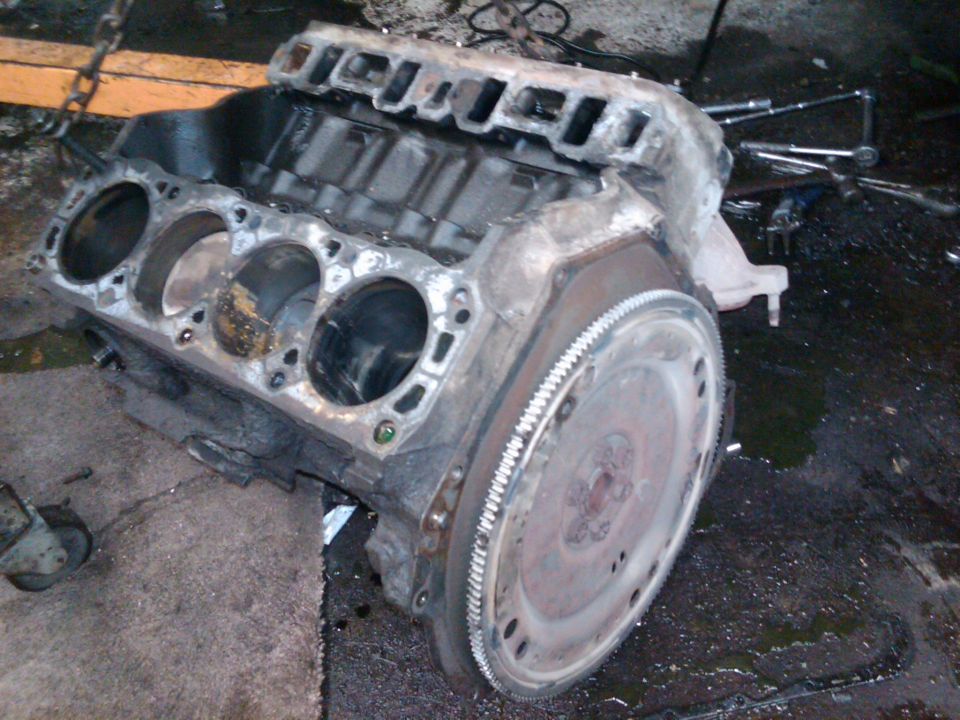 Engine block and flywheel, part of a vehicle transformation