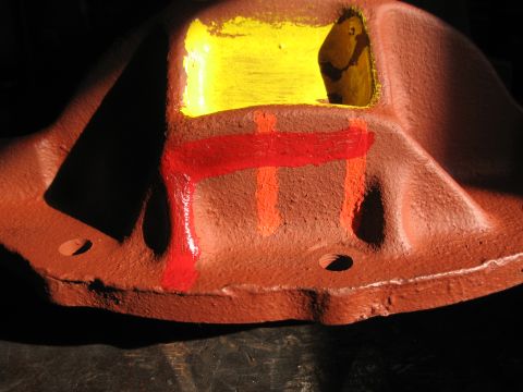 1968 Shelby GT500 - A differential housing painted with red and orange markings is shown up close.
