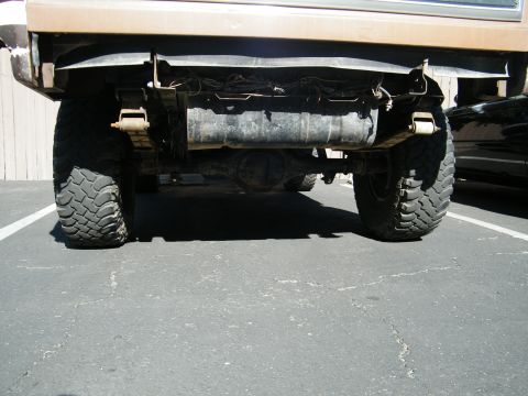 1982 Ford Bronco - Underside view of a truck's rear axle and suspension components.