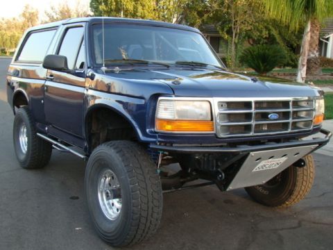 1982 Ford Bronco - This Ford Bronco features a custom front bumper and a roll cage visible through the windows.