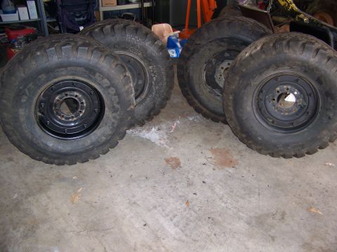 2001 Dodge 1500 - Four large off-road tires and wheels are shown, likely for a truck or SUV.