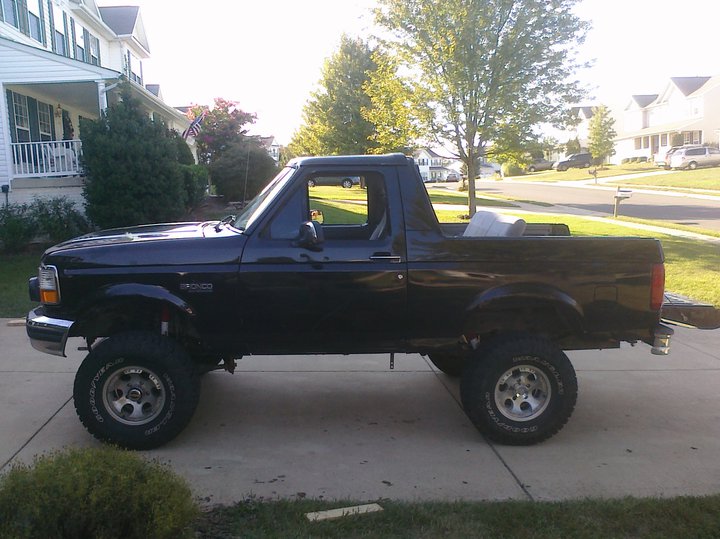 1995 Ford Bronco side profile, lifted with aftermarket wheels