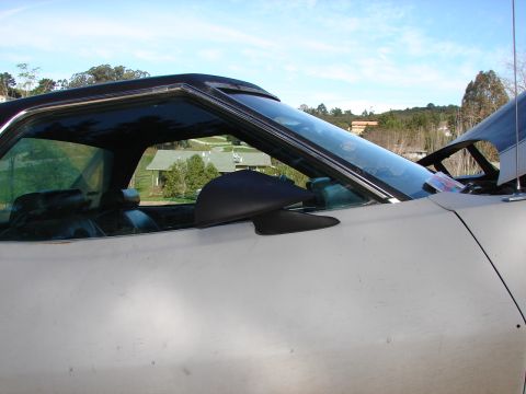 1973 Ford Ranchero - Side profile of a 1973 Ford Ranchero, showing its distinctive body style and interior details.