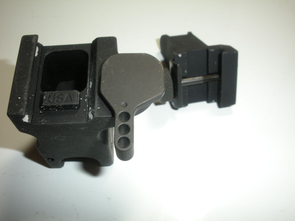 black gun sight mount with USA marking