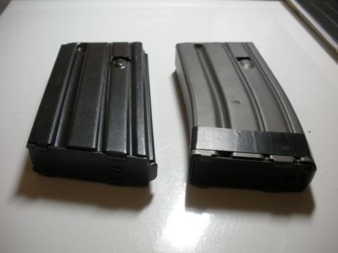 1996 Ford Bronco - Two rifle magazines are shown on a white surface.