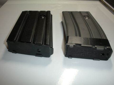 1996 Ford Bronco - Two rifle magazines are shown side-by-side on a white surface.