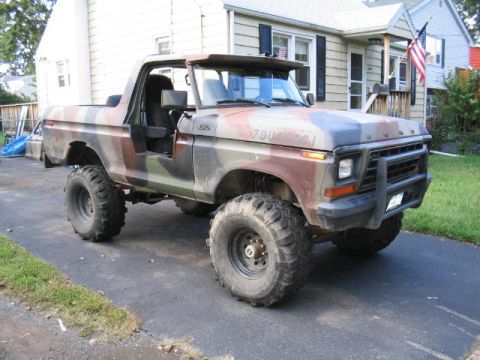 1979 Ford Bronco - This lifted 1978 Ford Bronco features a camouflage paint scheme and aggressive off-road tires.