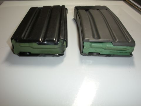 1996 Ford Bronco - Two firearm magazines are shown, each with a green follower visible at the base.