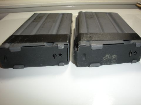 1996 Ford Bronco - Two rifle magazines are shown from a bottom perspective, with visible text on one.