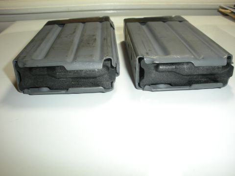 1996 Ford Bronco - Two rifle magazines are shown, each with a gray metal body and a black foam insert.