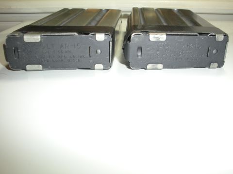 1996 Ford Bronco - Two Colt AR-15 rifle magazines are shown, each marked with caliber and manufacturer information.