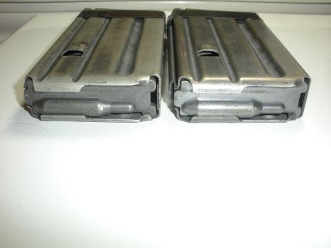 1996 Ford Bronco - Two metal rifle magazines are shown from the bottom view.