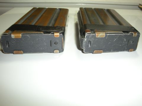 1996 Ford Bronco - Two rifle magazines are shown, one with visible text indicating it is for an AR-15.