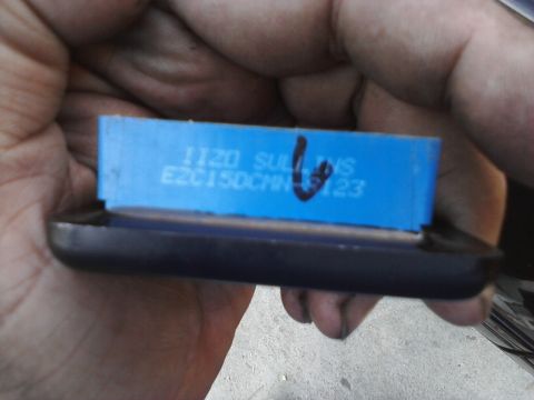 1995 Ford Taurus - Close-up of a blue electronic component with visible text and markings.