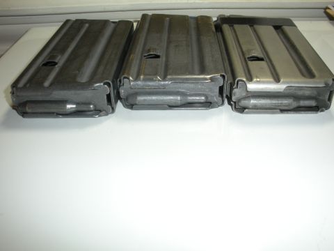 1996 Ford Bronco - Three rifle magazines are displayed side-by-side on a white surface.