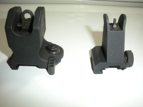 1996 Ford Bronco - Two black gun sights are displayed on a white background.
