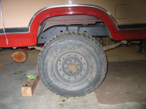 1984 Ford Bronco - This photo shows the rear wheel and fender area of a vehicle, possibly undergoing maintenance or modification.