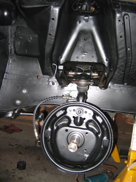 1971 Ford Ranchero - Undercarriage view of a vehicle's brake drum and suspension components.