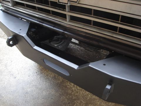 1989 Ford Bronco - Close-up view of a vehicle's front bumper and grille.