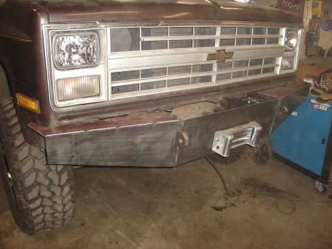 1989 Ford Bronco - The vehicle's front end features a custom-fabricated steel bumper with a winch mount, replacing the original.