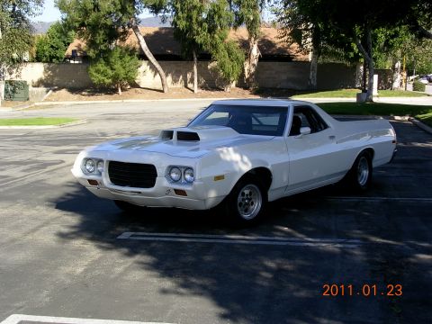 1972 Ford Ranchero - This 1972 Ford Ranchero features a prominent hood scoop and a classic pickup truck bed.