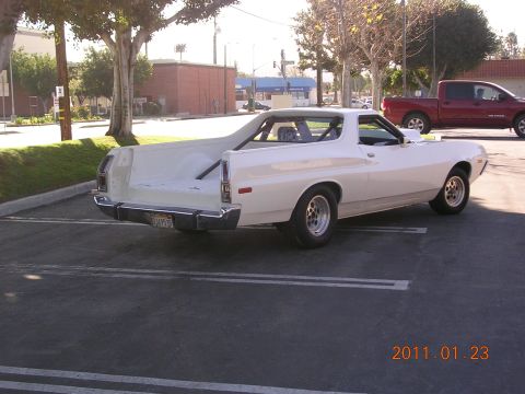 1972 Ford Ranchero - Rear view of a white 1972 Ford Ranchero pickup truck parked in a lot.