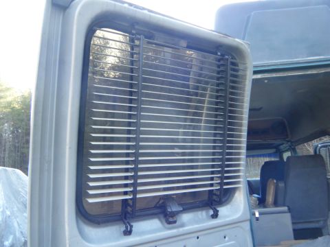 1981 Ford E350 - Van rear window interior view with blinds.
