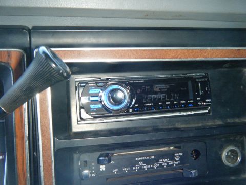 1981 Ford E350 - The dashboard features a Sony radio tuned to FM and displaying 'Zeppelin', alongside climate controls.