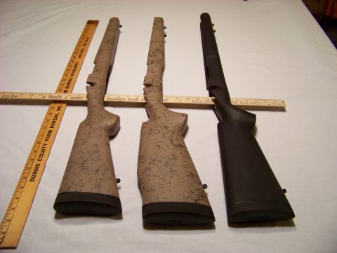 1995 Mercury Grand Marquis - Three gun stocks are laid out with rulers for scale, showing different camouflage patterns and a black option.