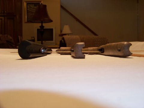 1995 Mercury Grand Marquis - Two metal parts are laid out on a white surface, with furniture visible in the background.