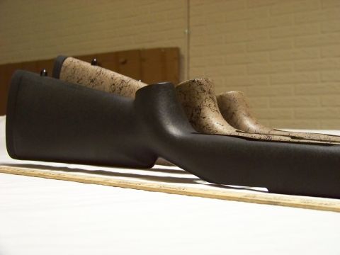 1995 Mercury Grand Marquis - Multiple gun stocks are displayed in varying finishes, laid out on a ruler.