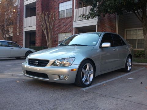 2008 Subaru Legacy - A silver Lexus IS300 sedan is parked in a lot with a brick building in the background.