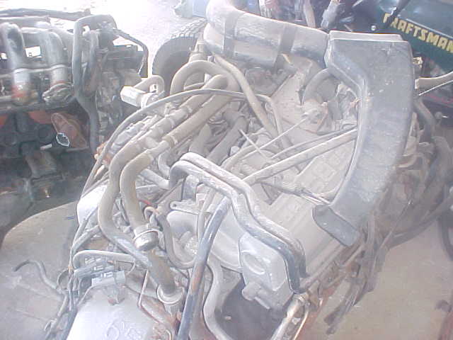 Engine hoses and metal components, some with rust