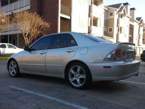 2008 Subaru Legacy - Silver sedan parked in front of apartment buildings.