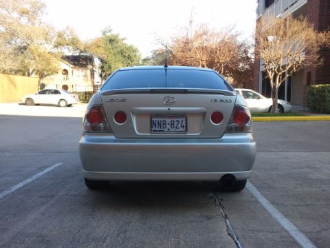 2008 Subaru Legacy - A silver Lexus IS 300 is parked in a lot, with another car visible in the background.