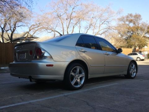 2008 Subaru Legacy - A silver sedan is parked in a lot under a clear sky with trees in the background.