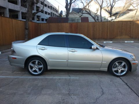 2008 Subaru Legacy - Side profile of a silver sedan parked in a lot.