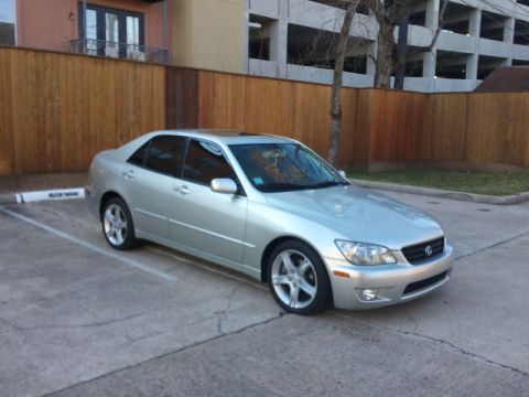 2008 Subaru Legacy - Silver Lexus IS300 sedan parked in a lot.