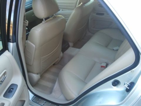 2008 Subaru Legacy - Interior view of tan leather seats in a car, showing the rear seating area.