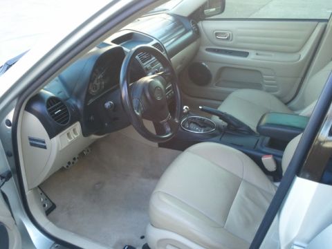 2008 Subaru Legacy - Interior of a Lexus IS300, likely from the mid-2000s, with tan leather seats and black trim.
