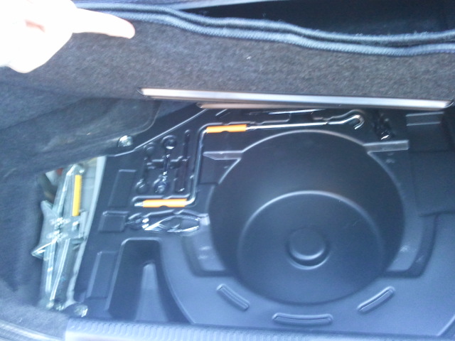 Spare tire well with jack and tools